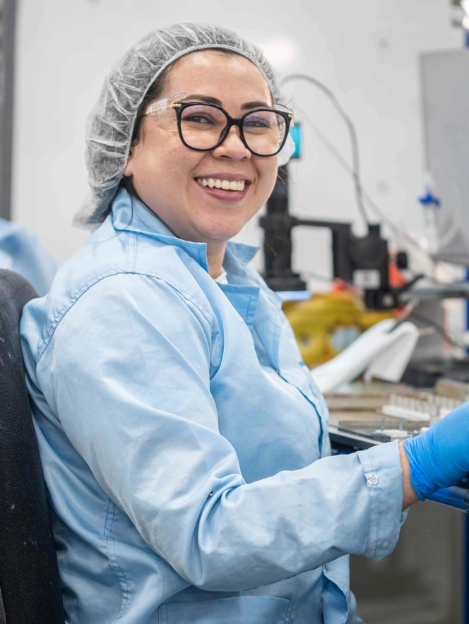 Smiling Lady In Blue Gloves